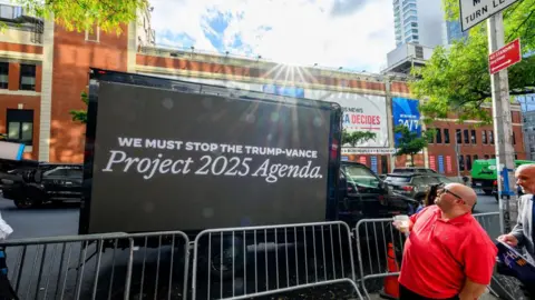 Getty Images Image showing a truck with a protest slogan against Project 2025