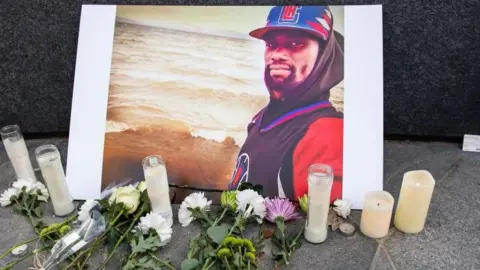 AFP  A photograph of Tyre Nichols is displayed at a memorial