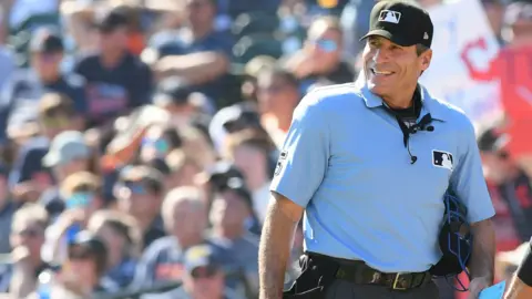MLB umpire Angel Hernández seen on the field during a game