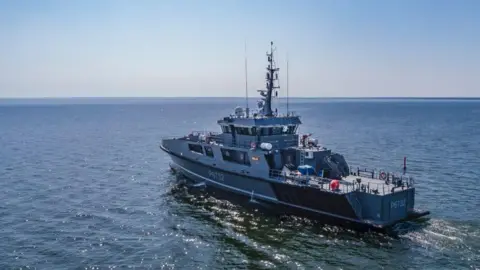 Estonian army patrol ship named Raju sails at sea on a sunny day