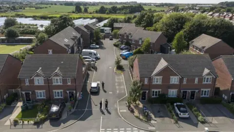 PA Media An aerial shot of police searching Axel Rudakubana's home