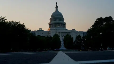 US capitol building as sun rises