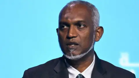 Getty Images Maldives' President Mohamed Muizzu speaks during the World Government Summit in Dubai on February 13, 2024.