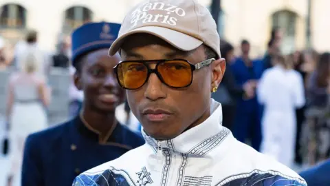 US designer Pharrell Williams (C) pose for a picture during the Vogue World Photocall in Paris, France, 23 June 2024