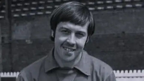 Black and white photo of goalkeeper Graeme Crawford