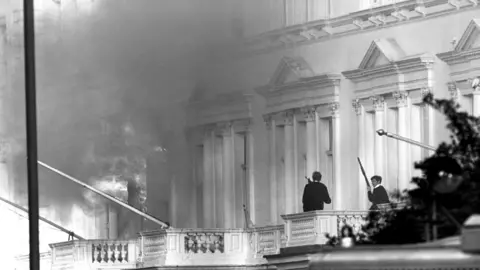 PA Media Black and white photograph of armed police on the adjoining balcony to the Iranian Embassy, when units of the Special Air Service (SAS) helped police end the six day siege at the building