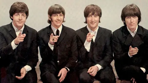 Getty Images The Beatles pictured at the BBC in 1966 (L-R): Paul McCartney, Ringo Starr, John Lennon and George Harrison