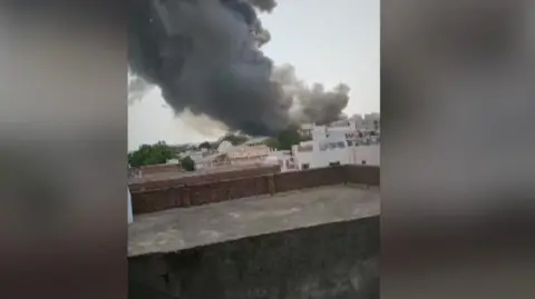 Smoke rising in Ahmedabad