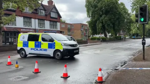 Leicester Media Online A police van in a coned off road
