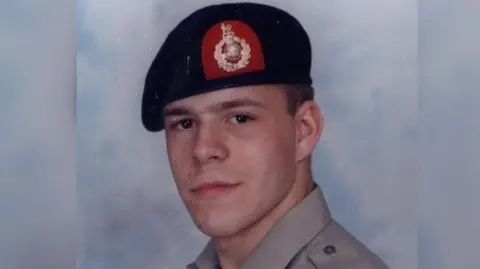 Supplied A young man wearing a black military beret smiles at the camera.