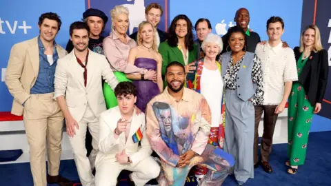 Getty Images Dunster with a variety of other cast members of Ted Lasso lined up ahead of the Ted Lasso premiere in the United States 