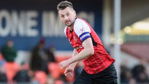 Paudie O'Connor in action for Lincoln City