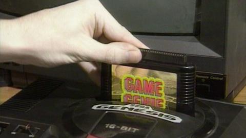 Game Genie being put into Sega console
