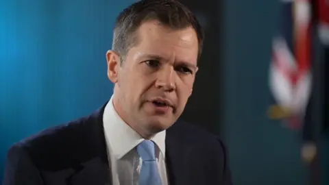 Robert Jenrick Close up in an interview with the BBC