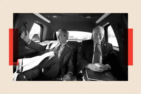 Getty A black-and-white photo of George Bush and Dick Cheney in the back of a taxi