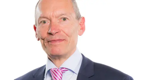 Senedd Cymru A head and shoulders picture of John Griffiths smiling at the camera 