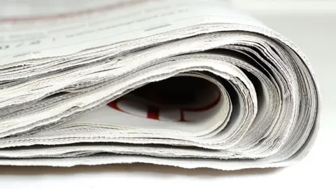 Getty A stock image shows the edge of a folded newspaper