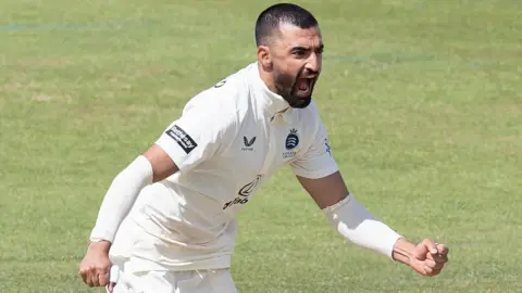 Zafar Gohar shouts in celebration after taking a wicket for Middlesex against Northamptonshire
