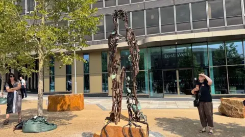A bronze sculpture of a silhouette inspired by flora in Nottingham