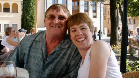 Supplied Amanda and David sitting next to eachother at a restaurant