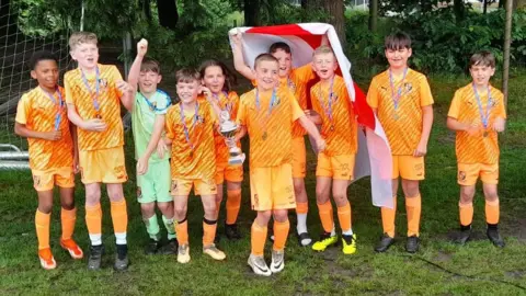 St Johns FC/Neil Frost The St Johns under 10s celebrate winning the Dutch Cup in the Netherlands