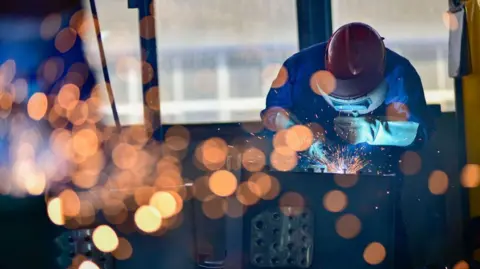 Getty images workers welding parts at a frying cars factory in Qingzhou, in the Eastern Shandong County on October 31, 2024