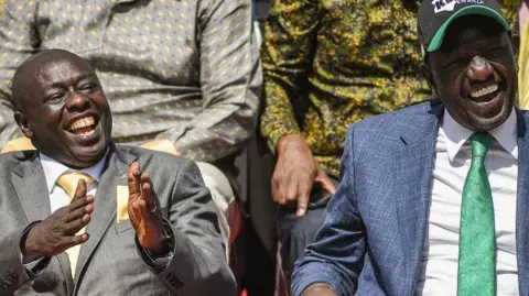 Getty Images William Ruto (R) sits next to Rigathi Gachagua in Karen, Nairobi, on 15 May 2022