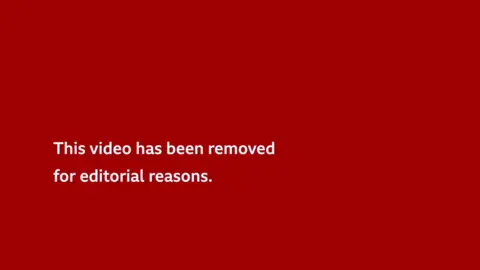White text on a red background that says This video has been removed for editorial reasons.