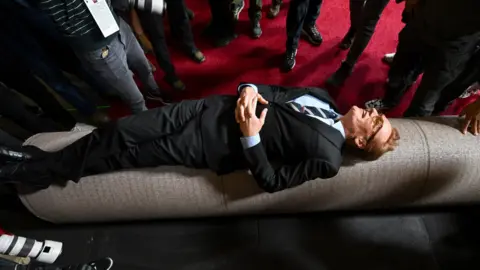 Getty Images Conan O'Brien lying on the red carpet