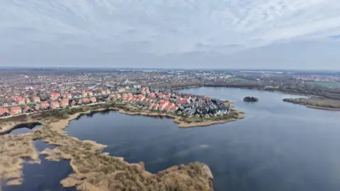 A drone image of the Hampton Heights area - with houses and water around them.