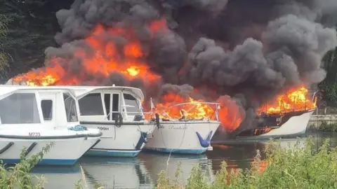 Three boats on fire