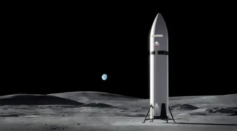 SpaceX A computer-generated illustration depicts a large, gleaming silver spacecraft against the black void of space, with the curved grey surface of the Moon visible below. The spacecraft is enormous: a sleek, cylindrical structure dominated by a rounded nosecone at the top, where the crew compartment is located some 35 metres above the lander's base. Fins extend from the lower section. Stars and the distant Earth are just visible in the background. 