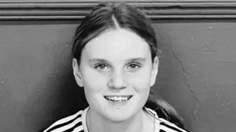 PA Media Black and white picture of a teenage girl with long hair in a pony tail