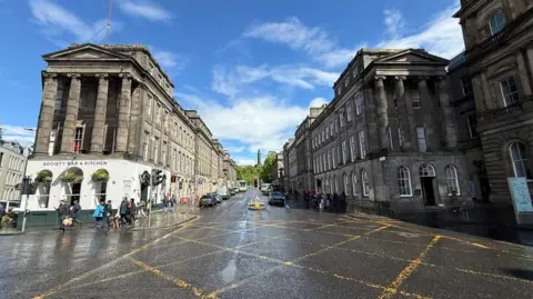 A general view of Waterloo Place on a wet but sunny day.