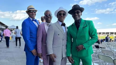BBC/Brandon Drenon Four guys pose for a photo inside Pimlico