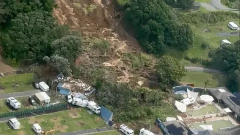 An aerial view of a landslide above a camping ground in Mt Maunganui, New Zealand