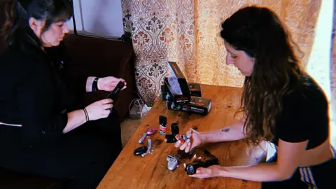 Mehala and Bryony looking at the kit