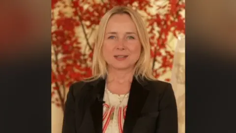 Katie Razzle wearing a dark coloured jacket.