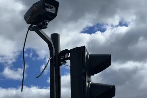 BBC Snipped wires on a camera in Bromley