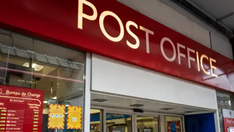 Stock image of an entrance to a Post Office