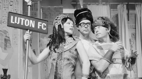 Getty Images Eric Morecambe and Ernie Wise dressed as ancient Egyptians alongside actress Glenda Jackson