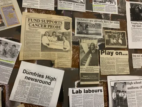 A selection of press clippings on a board