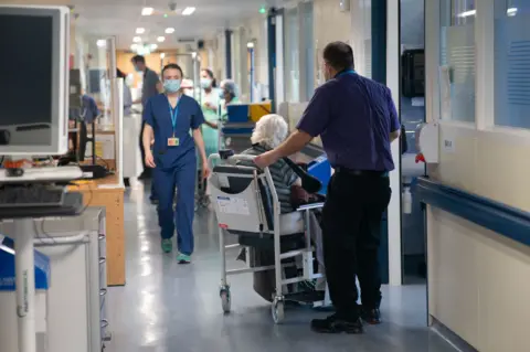 A general view of staff on a NHS hospital ward at Ealing Hospital in London.