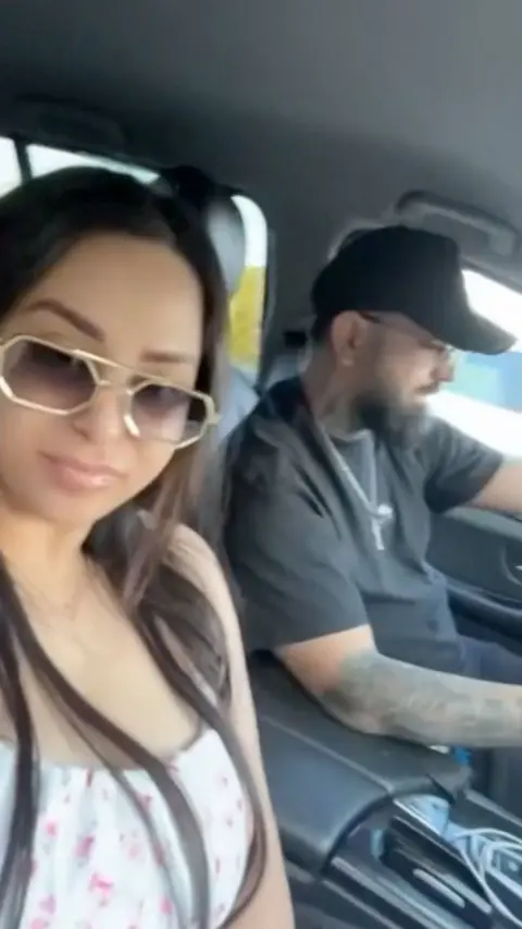A woman and a man inside a car.