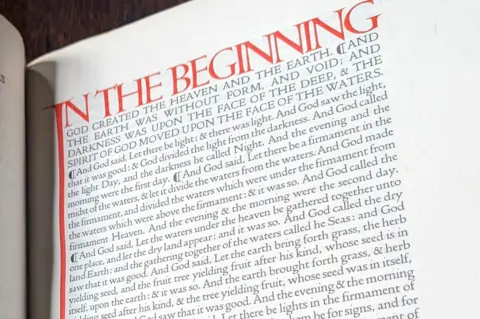 Lucinda MacPherson A page of the Doves Bible showing text from the bible written in red and black using Doves Type