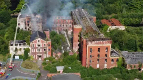 NIFRS An aerial view of the Victorian mill complex at Hilden, near Lisburn, as firefighters tackled a major fire attack in June 2021