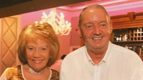 Richard Mawson and his wife Mary pose together on an evening out