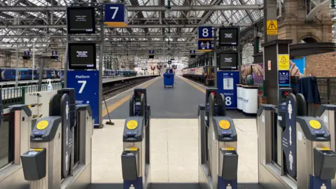 Platforms 7 and 8 barriers at a deserted Glasgow Central Station