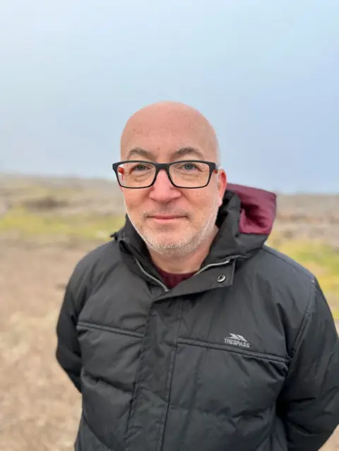 David Mackay on the shingle in Kingston