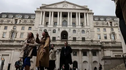 Getty Images People walking past the Bank of England